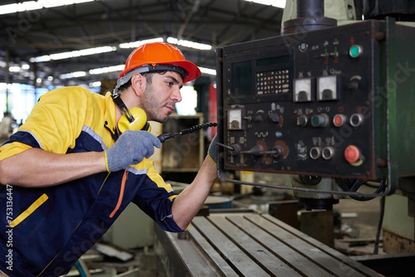 Fototapeta engineer or technician fixing lathe machine in the factory