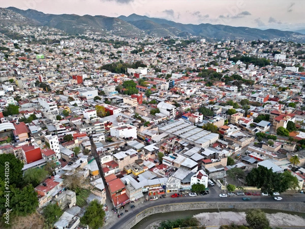 Fototapeta Drone-captured horizontal aerial view showcasing the vibrant and varied neighborhoods of Chilpancingo