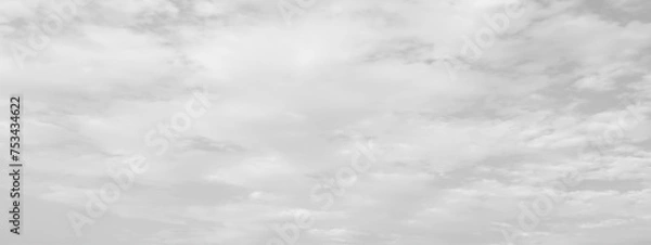 Fototapeta White cloud in the sky. View on a soft white fluffy cloud as background. Cloudy sky, white clouds, black background pattern. 