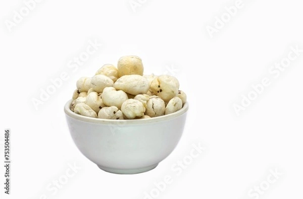 Obraz Fox Nut or Makhana in a White Bowl Isolated on White Background with Copy Space, Also Known as Lotus Seed Pop, Euryale Ferox or Gorgon Nut