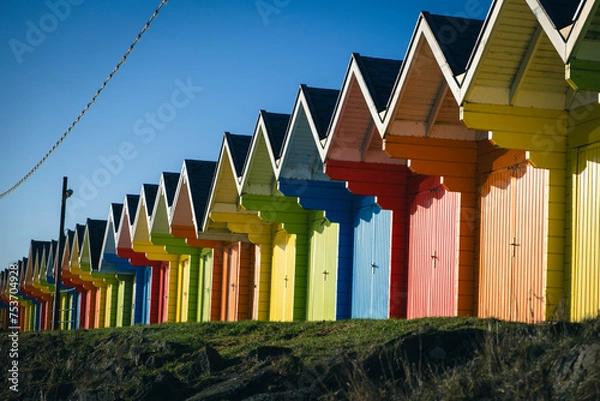 Fototapeta colourful beach huts 