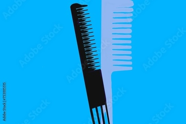 Obraz a digital illustration of two colored  hair combs in a blue background