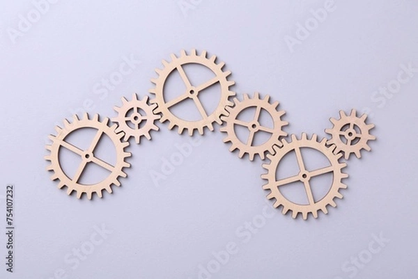 Fototapeta Business process organization and optimization. Scheme with wooden figures on light background, top view