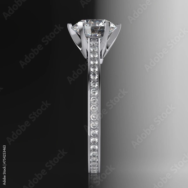 Fototapeta Diamond engagement ring with a 2 carat round brilliant cut stone, six prong setting, shoulder style, grain set side stones. Side profile view on gradient black and white background. 3D rendering