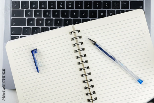 Obraz Laptop with block notes and pen