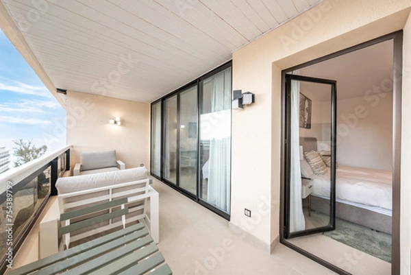 Obraz a balcony terrace with chairs and table in mediterranean holiday real estate 