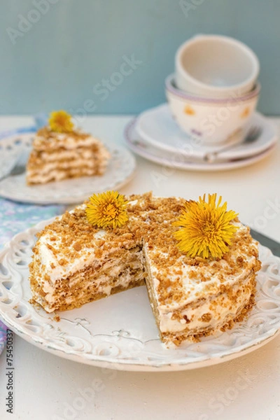 Fototapeta Layered honey cake with chantilly cream