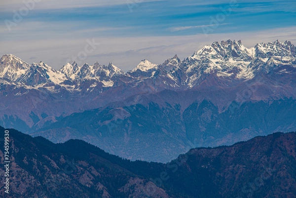 Fototapeta Layered Mountain Majesty: Himalayas as Seen from Murma Top, Nepal