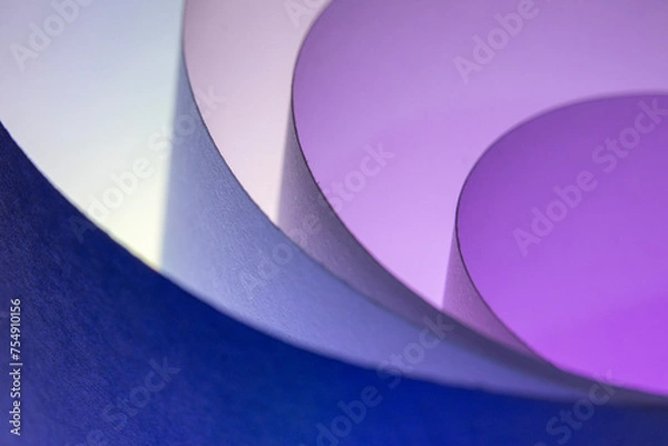 Fototapeta When I roll paper into many circles, I create a background with a sheet of paper and lights made up of different colors.