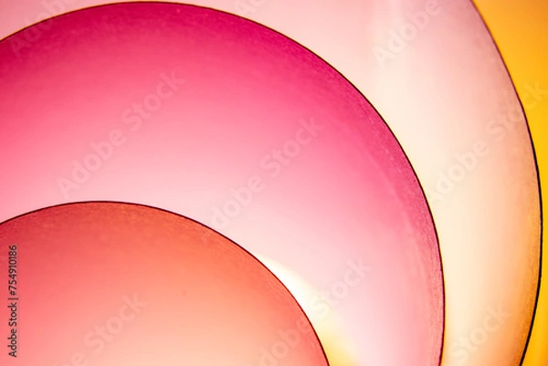 Fototapeta When I roll paper into many circles, I create a background with a sheet of paper and lights made up of different colors.