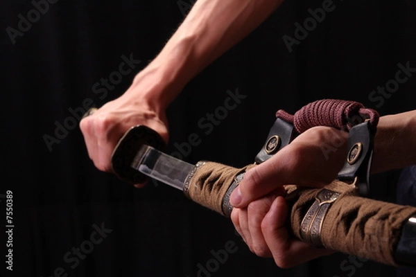 Obraz Man holding samurai sword