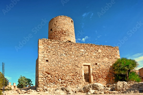 Fototapeta An old stone tower in Majorca, Spain