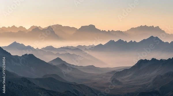 Fototapeta A majestic landscape of a mountain range at dawn, with the first light casting golden hues over the peaks. The Sony A7R IV's 61-megapixel sensor should capture the intricate details of the rugged 
