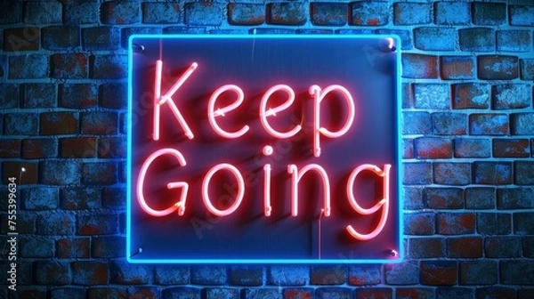 Obraz Keep Going in neon lettering, mounted on a rustic brick wall background, serving as a constant reminder of perseverance and determination