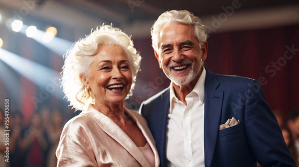 Fototapeta A sophisticated senior couple is laughing joyously at a gala, symbolizing lifelong happiness and enduring partnership