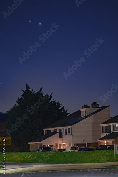 Fototapeta The Great Conjunction an amazing and historical astronomical event. Jupiter and Saturn planets in the night sky appearing as a rare phenomenon over a Dutch village in Netherland 
