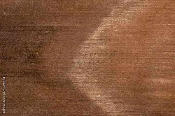 Fototapeta Aerial view of a wheat field after harvest. Top view.