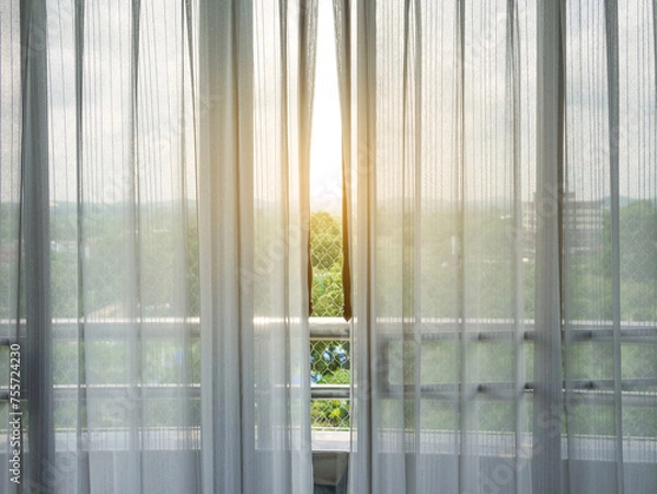 Fototapeta White sheer curtains and balcony with high angle view
