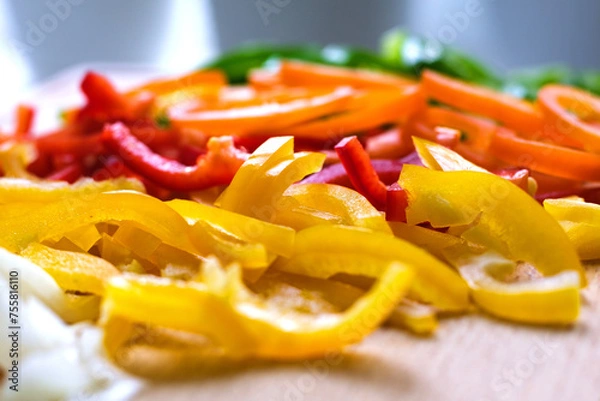 Fototapeta Close-Up View of Colorful Bell Pepper Strips for Healthy Lifestyle and Cooking Themes