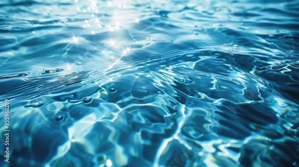 Fototapeta Sunlight shining on water surface, perfect for nature-themed projects.