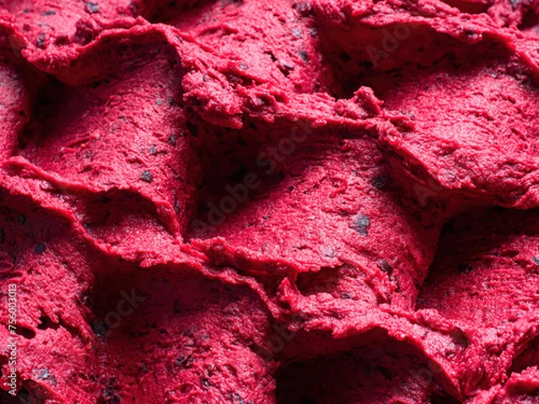 Fototapeta Frozen Black Currant flavour gelato - full frame detail of sorbet. Close up of a red surface texture of Ice cream filled with pieces of mixed fruit.