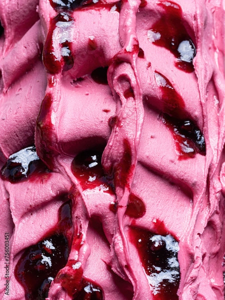 Fototapeta Frozen Pomegranate flavour gelato - full frame detail. Close up of a pink surface texture of Ice cream covered with  red syrup.