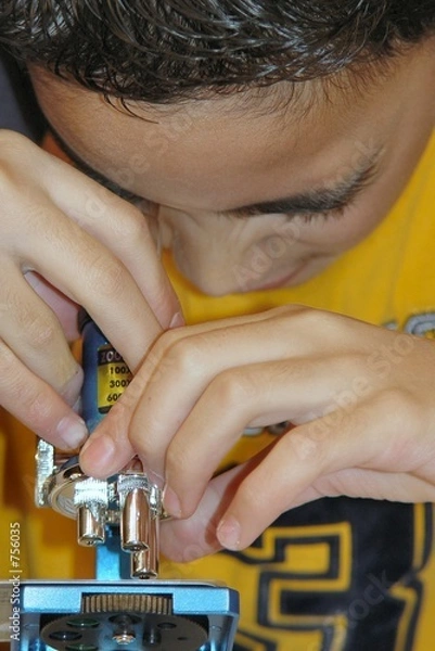 Obraz child focusing his microscope