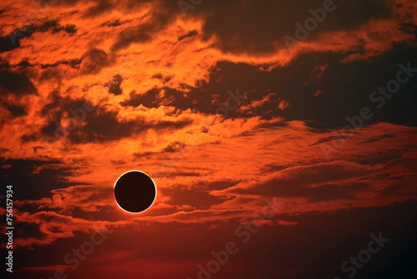 Obraz eclipse on the dark red sunset sky and transparent cloud