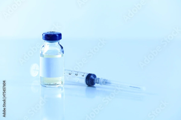 Fototapeta Vaccine in vial with syringe