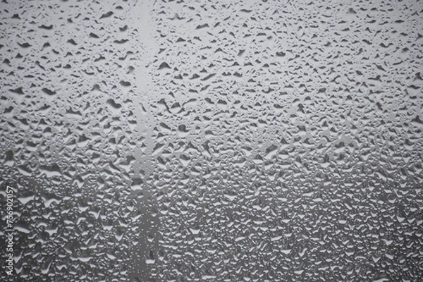 Fototapeta Close-up view of a window covered with raindrops