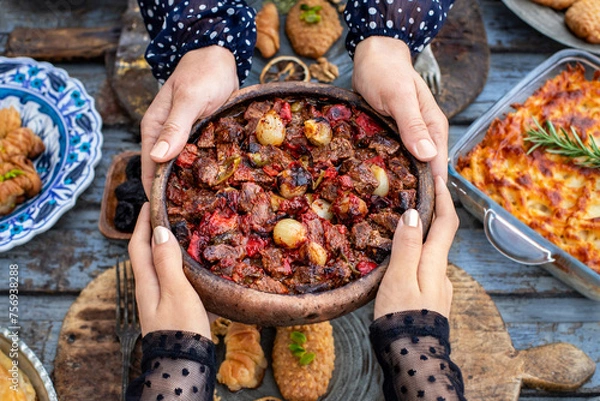 Fototapeta Casserole kebab named belen tava or sac saç kebabı . Roasted meat with pepper and tomato. 