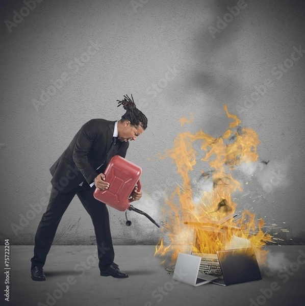 Fototapeta Businessman burns computers