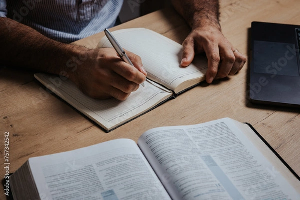 Fototapeta Man is ready to study the Bible and make notes in his notebook