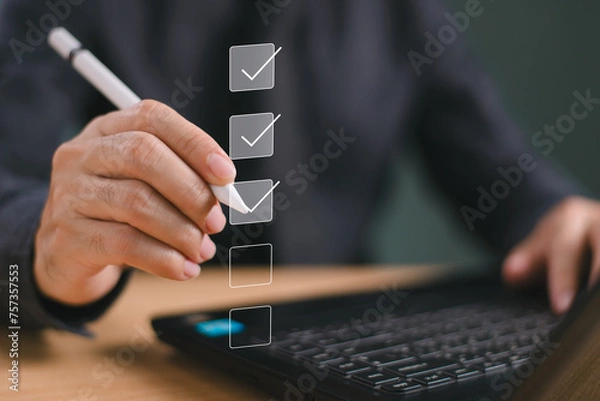 Obraz Business performance summary checklist review, businessman with computer online evaluate checklist survey, fill digital report form as assessment, questionnaire, evaluation, check online survey