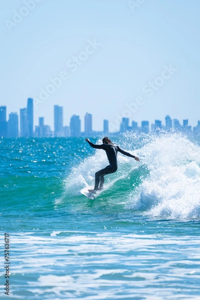 Obraz Male surfer riding a wave like a pro in Gold Coast, Queensland, Australia