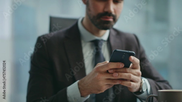 Fototapeta Positive manager messaging telephone sitting office closeup. Worker reading sms 