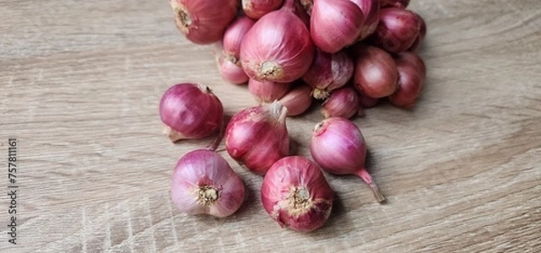Obraz Red onions for cooking on the table.