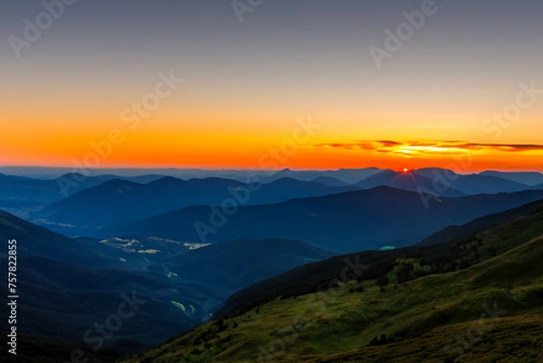 Fototapeta Sunset at mountain background