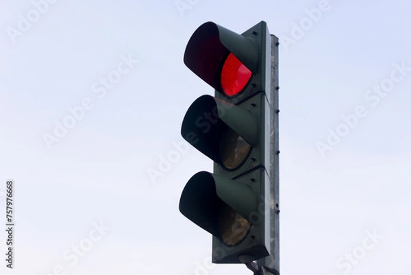 Obraz Red traffic light turns on, isolated on sky background