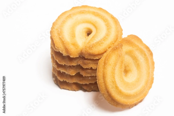 Obraz Stacked of danish butter cookies the vanilla ring cookie isolated on white background clipping path
