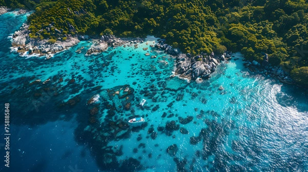 Fototapeta A photo of the Similan Islands, with crystal clear water and vibrant coral reefs as the background, during a sunny day