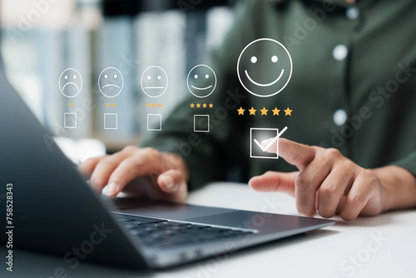 Fototapeta Customer satisfaction survey concept businesswoman use laptop Touch the happy smiley icon. Satisfied. 5 stars. Service experience rating. online application Satisfaction Review best quality.