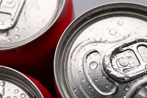 Fototapeta Energy drinks in wet cans, closeup. Functional beverage