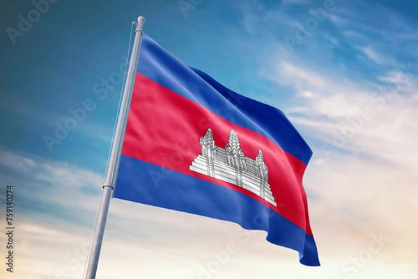 Obraz Waving flag of Cambodia in blue sky. Cambodia flag for independence day. The symbol of the state on wavy fabric.