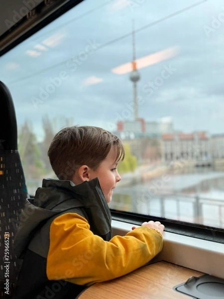 Obraz child looks out the train window