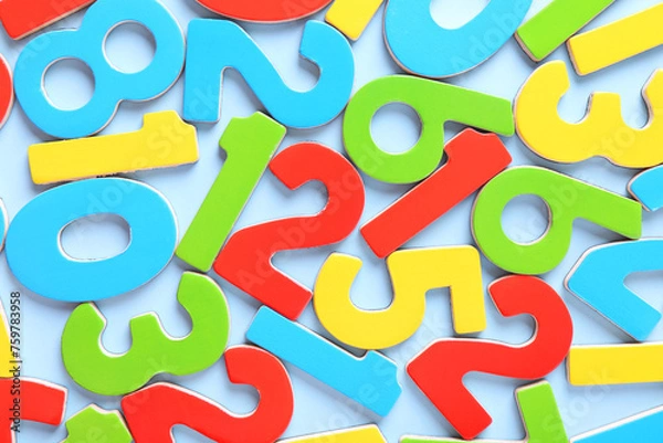 Obraz Colorful numbers on light blue background, flat lay