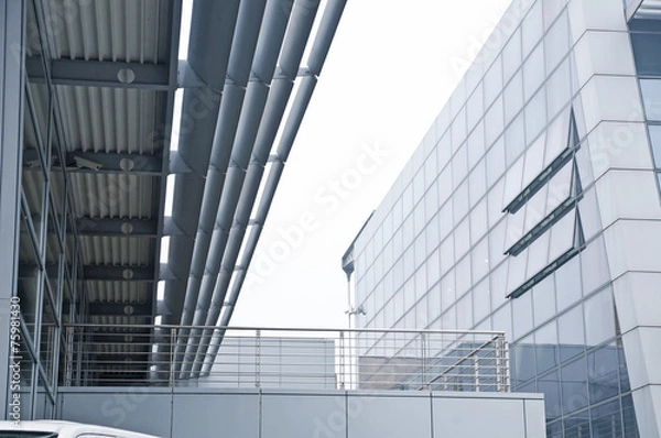 Fototapeta outside of a modern industrial building with stained glass windo