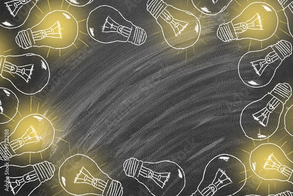 Fototapeta A set of glowing light bulbs drawn with chalk on a blackboard. Concept of brainstorming process.