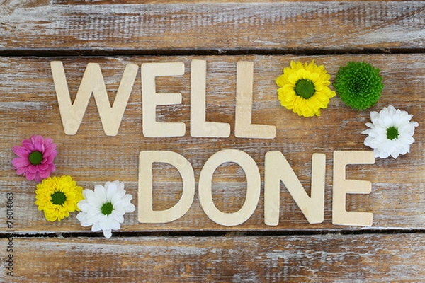 Obraz Well done written with wooden letters, and santini flowers