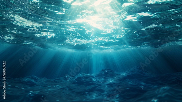 Fototapeta Dark blue ocean surface seen from underwater, Underwater light rays background